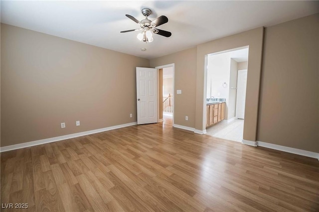 spare room with ceiling fan and light hardwood / wood-style flooring