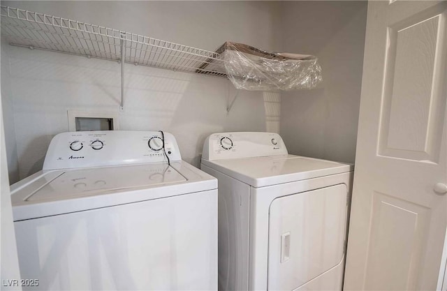 clothes washing area featuring washing machine and clothes dryer