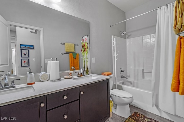 full bathroom with shower / tub combo, vanity, hardwood / wood-style flooring, and toilet