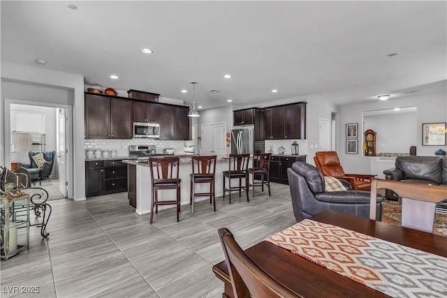 living room featuring light tile patterned flooring and sink