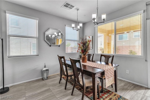 dining space featuring a chandelier