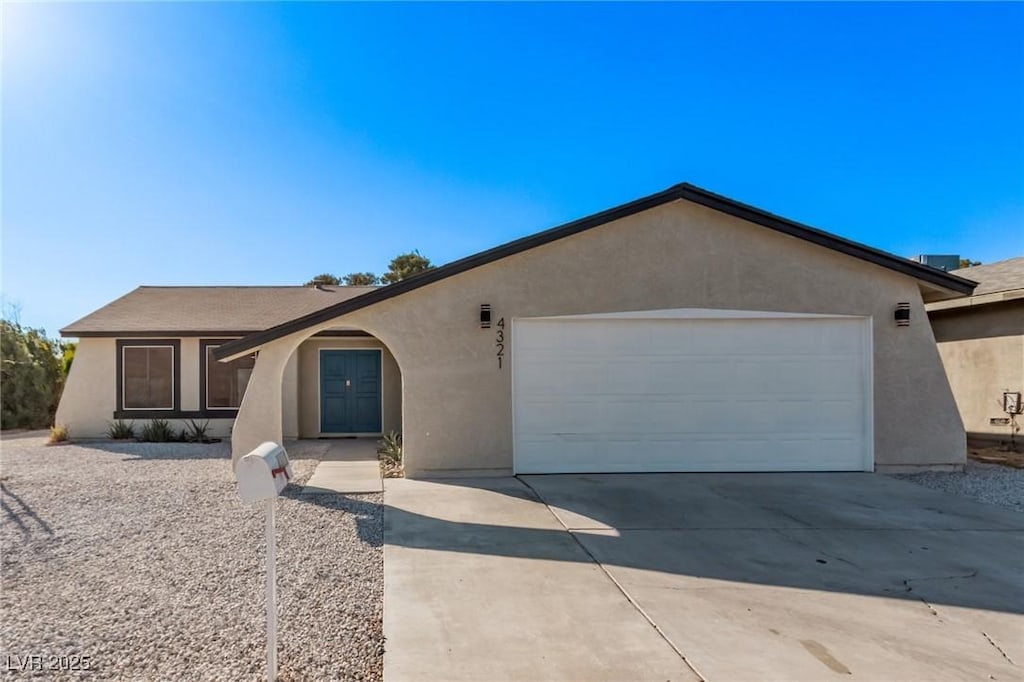 single story home featuring a garage