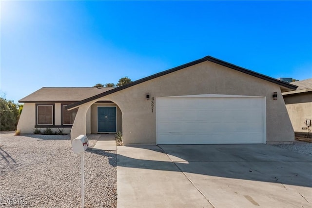 single story home featuring a garage