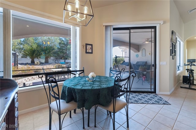 dining area featuring an inviting chandelier and light tile patterned flooring