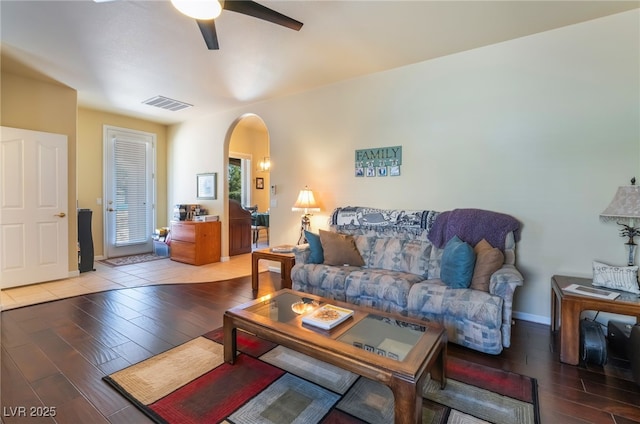 living room featuring hardwood / wood-style flooring and ceiling fan