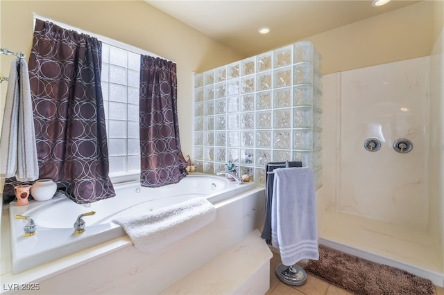 bathroom featuring plenty of natural light, tile patterned floors, and independent shower and bath