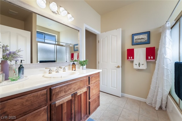 bathroom featuring shower / bath combination with curtain, vanity, and tile patterned floors