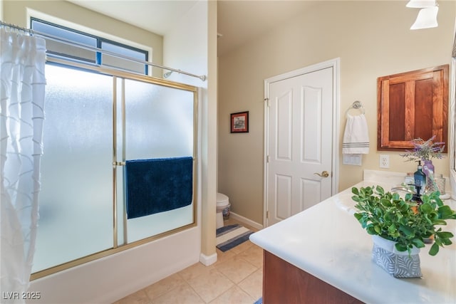 full bathroom with tile patterned flooring, vanity, shower / tub combo, and toilet