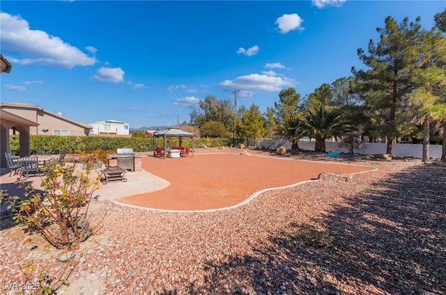 view of yard featuring a gazebo and a patio