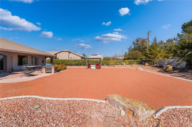 view of yard featuring a gazebo and a patio area