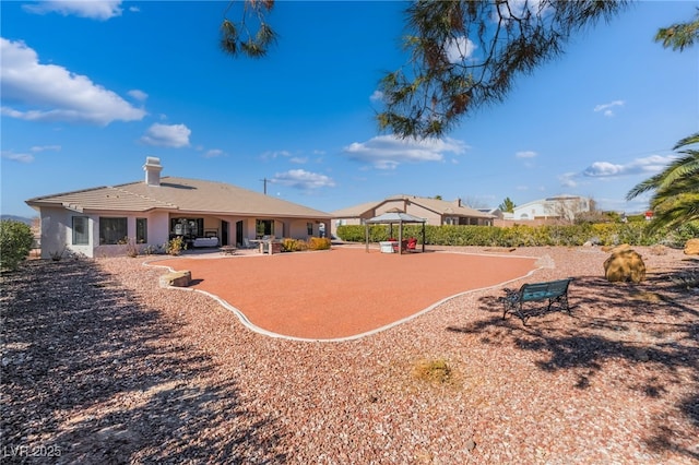 exterior space featuring a gazebo and a patio area