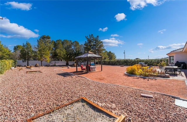 view of yard with a gazebo and a patio