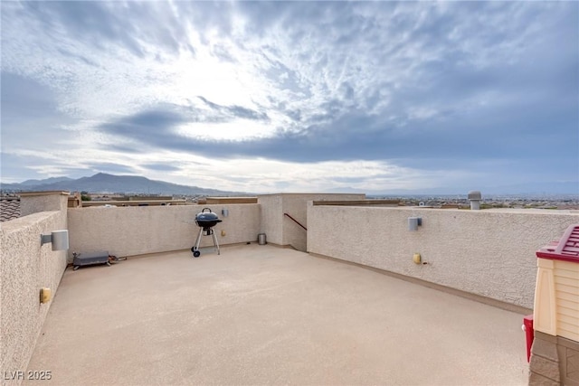 view of patio / terrace featuring a mountain view