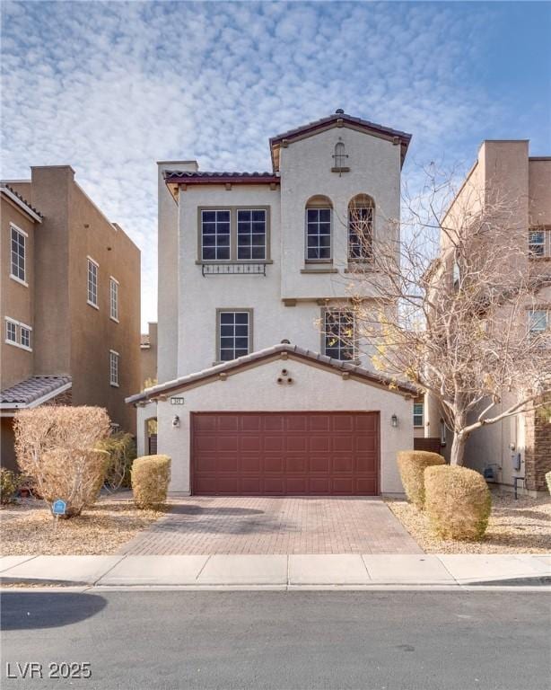 mediterranean / spanish-style house featuring a garage