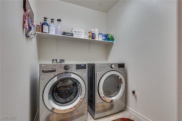 laundry room with washing machine and clothes dryer