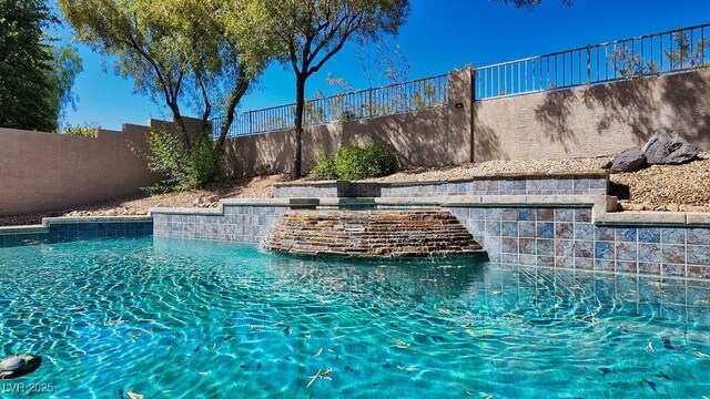 view of pool featuring pool water feature