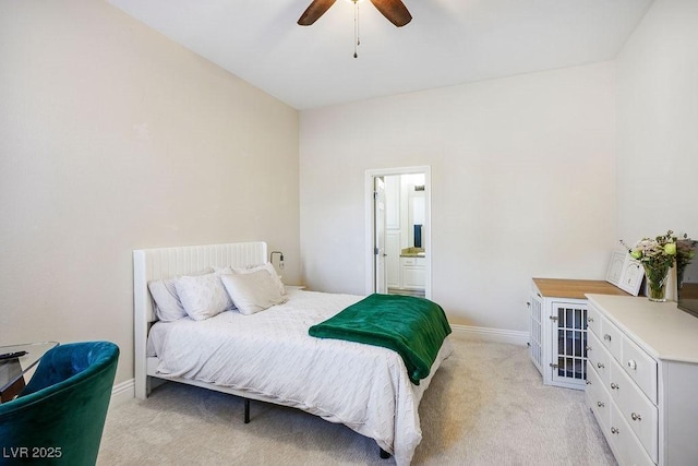 bedroom with baseboards, ceiling fan, connected bathroom, and light colored carpet