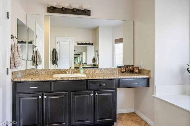 2012 Poetry Ave, Henderson, NV 89052 - bathroom featuring tile patterned flooring, vanity, and baseboards