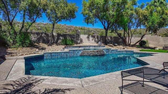 2012 Poetry Ave, Henderson, NV 89052 - view of swimming pool featuring a patio area, a fenced backyard, and a pool with connected hot tub