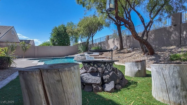 view of pool with a fenced backyard and a fenced in pool