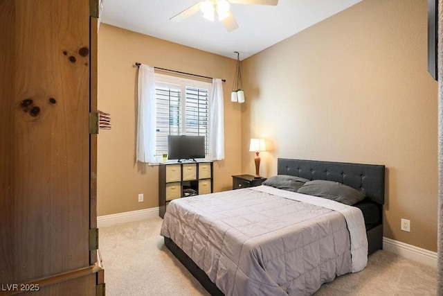 bedroom with baseboards, ceiling fan, and light colored carpet