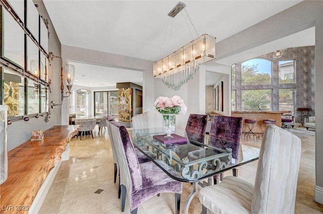 dining space featuring an inviting chandelier