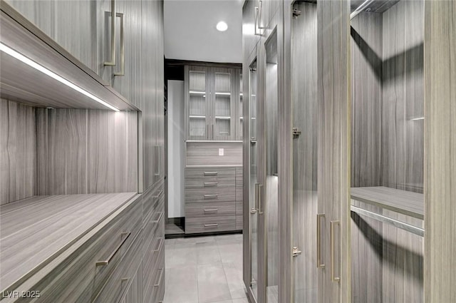 walk in closet featuring light tile patterned floors