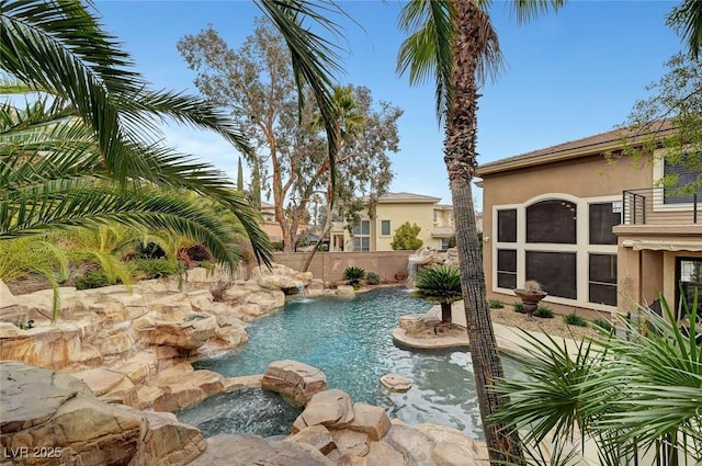 view of pool featuring an in ground hot tub