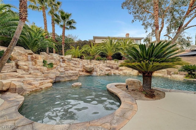 view of pool with pool water feature