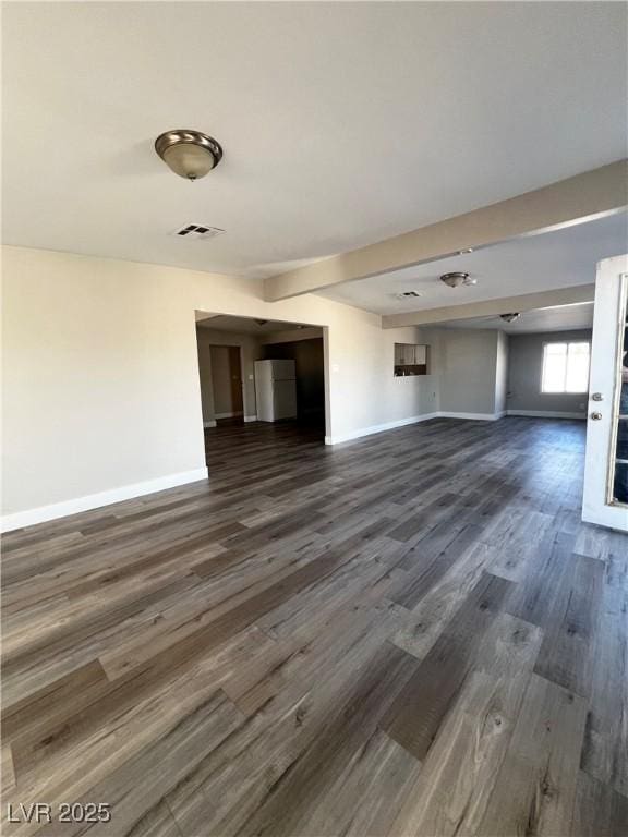 unfurnished living room featuring dark hardwood / wood-style flooring