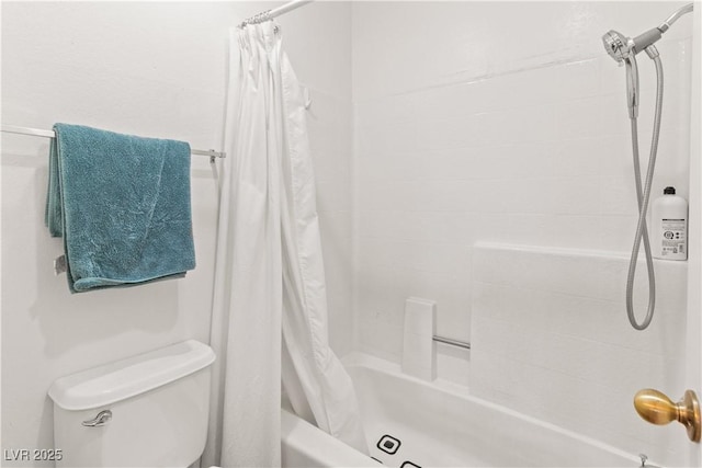 bathroom with toilet and shower / bath combo with shower curtain