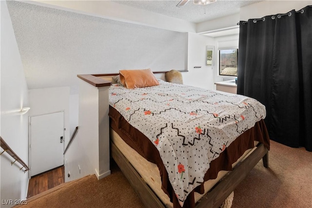 carpeted bedroom featuring a textured ceiling