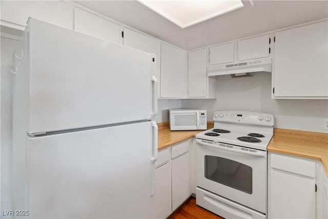 kitchen with white cabinetry and white appliances