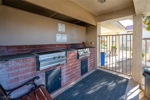 view of patio with area for grilling and exterior kitchen