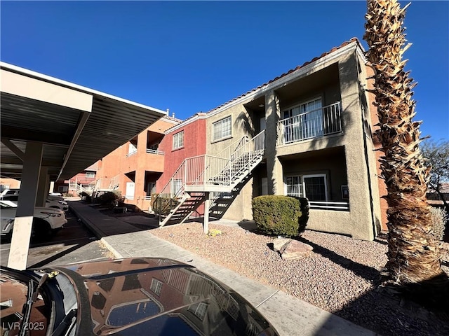 view of property featuring stairway