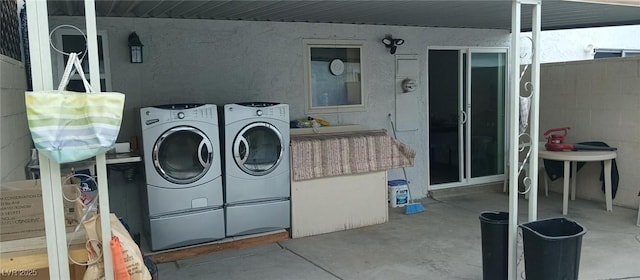 washroom featuring washer and clothes dryer