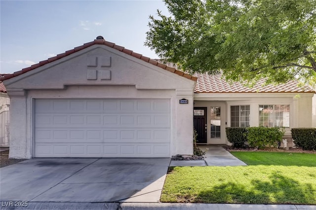 mediterranean / spanish house featuring a garage and a front lawn