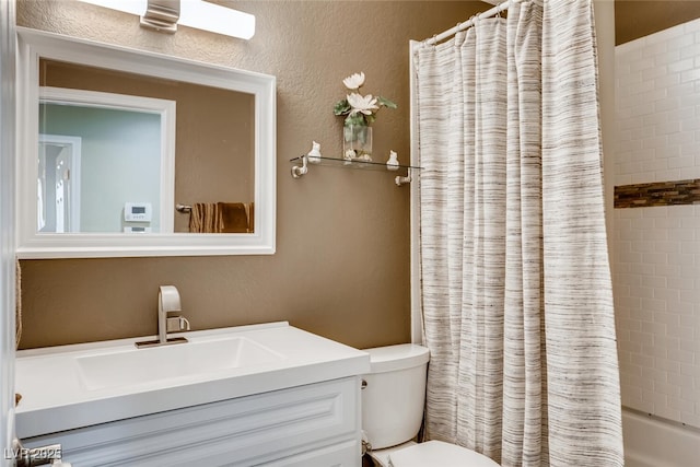 full bathroom featuring vanity, shower / bathtub combination with curtain, and toilet