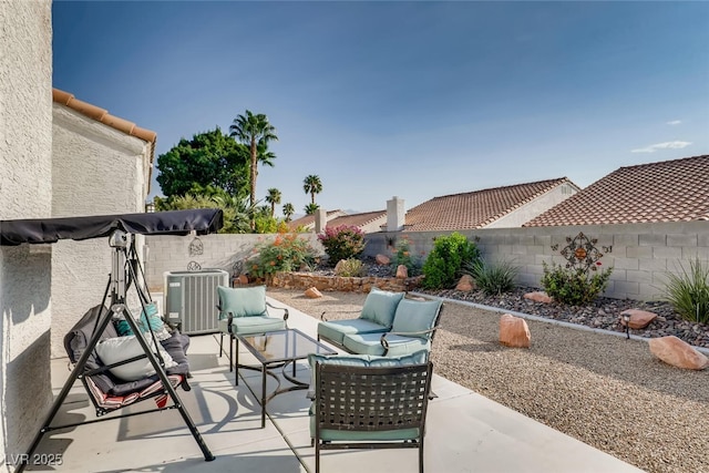 view of patio / terrace featuring an outdoor living space and central air condition unit