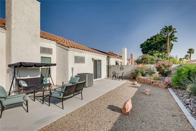 view of patio with an outdoor hangout area and central air condition unit