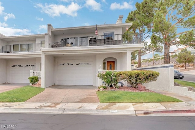 view of front of home featuring a garage and a balcony