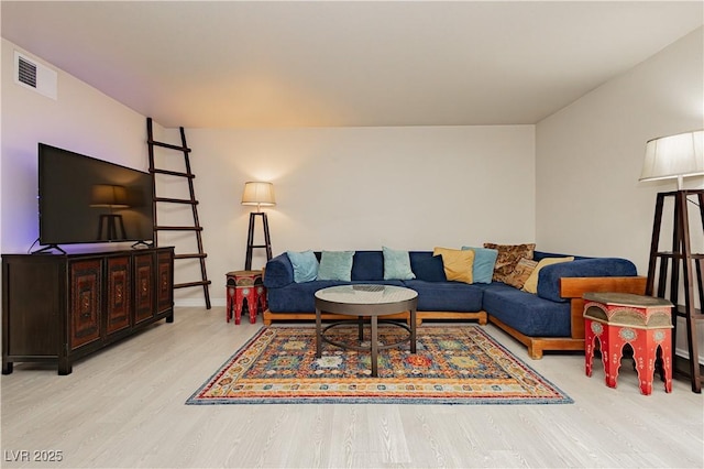 living room with light hardwood / wood-style floors