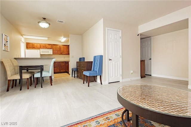 sitting room with light hardwood / wood-style floors