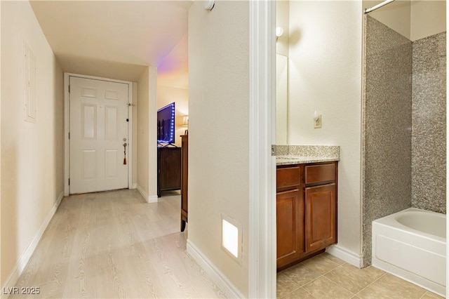 corridor featuring light hardwood / wood-style floors