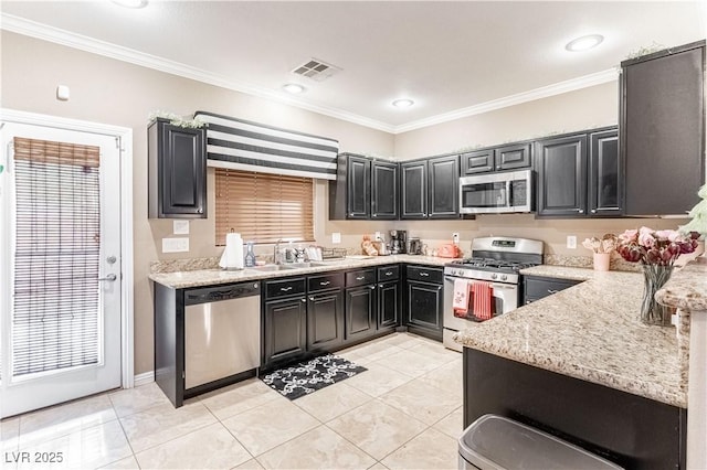 kitchen featuring sink, crown molding, appliances with stainless steel finishes, light stone counters, and light tile patterned flooring