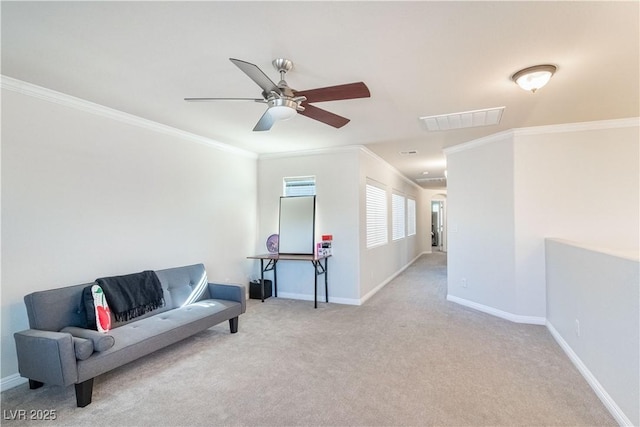 living area featuring ornamental molding, light carpet, and ceiling fan