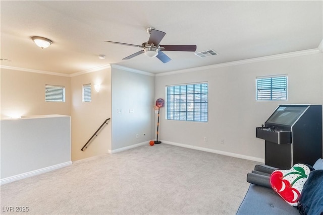 sitting room featuring crown molding, light colored carpet, and ceiling fan