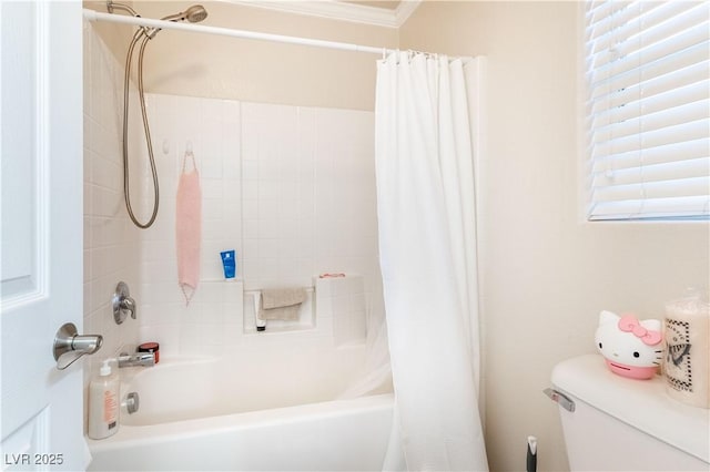 bathroom featuring shower / bath combination with curtain, ornamental molding, and toilet