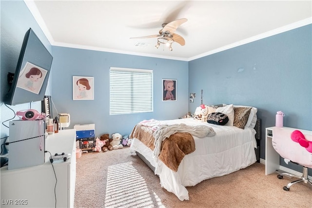 bedroom with crown molding, ceiling fan, and carpet floors