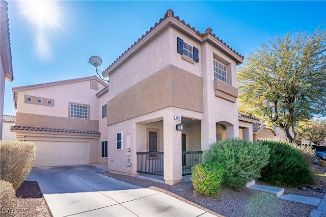 mediterranean / spanish-style home with a garage